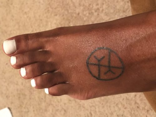 Morgan says: I've always been really sensitive to other people's feelings. The last year or two I recognized that I was extremely empathetic, to the point where I could feel other people's energy or pain. I wanted to get a tattoo that represented how I put myself in other people's shoes all the time. So I got the empathy symbol on my foot. I love how on the outside of me, people see what's going on the inside me, sort of.